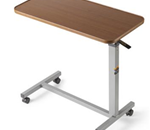Overbed Table - 
    Light upward touch on patented, spring-loaded lock